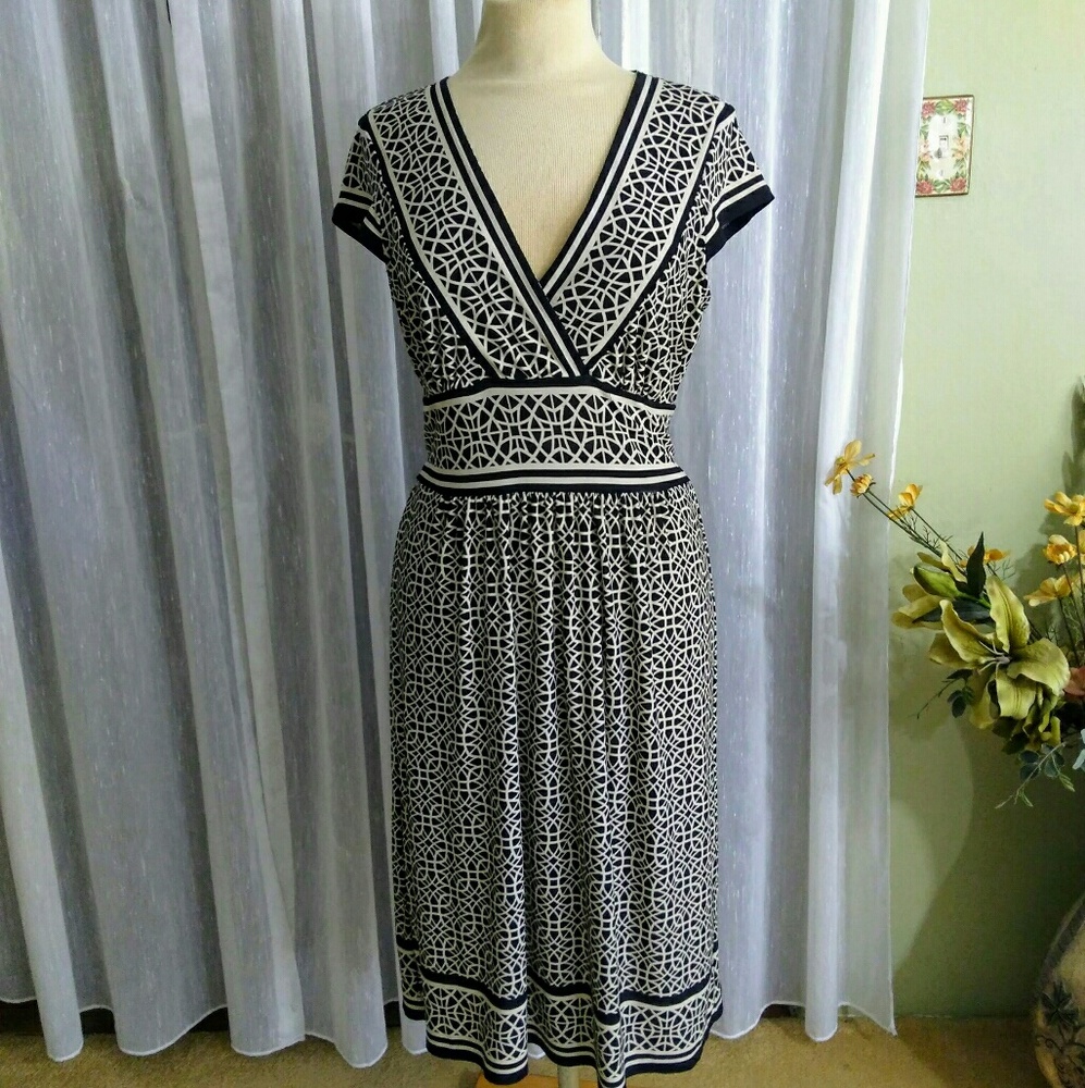 Midi size large cape sleeve black and ivory dress